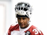 Deone Bucannon #36 of the Arizona Cardinals adjusts his shoulder pads during a Rookie Minicamp practice on May 23, 2014