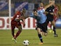 Uruguay defender Diego Godin battles for possession on November 13, 2013.