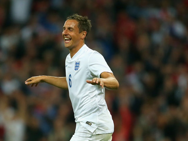 Phil Jagielka of England celebrates scoring their third goal during the international friendly match between England and Peru at Wembley Stadium on May 30, 2014