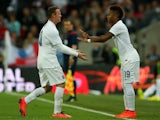 Raheem Sterling of England replaces Wayne Rooney of England during the international friendly match between England and Peru at Wembley Stadium on May 30, 2014