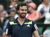 Latvia's Ernests Gulbis grins during the French Open fourth round match against Roger Federer in Paris on June 1, 2014