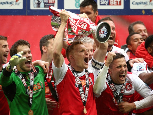 Fleetwood players celebrate promotion from Division 2 after the Sky Bet League Two Playoff Final between Burton Albion and Fleetwood Town at Wembley Stadium on May 26, 2014