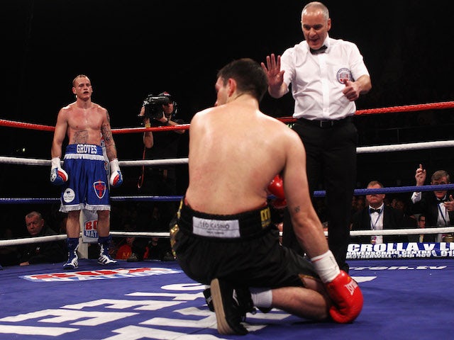 George Groves of England stands in the corner as the referee counts to Paul Smith of Engalnd in their British and Commonwealth Super-middleweight championship fight on November 5, 2011