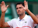 Guillermo Garcia-Lopez of Spain celebrates victory in his men's singles match against Stanislas Wawrinka of Switzerland on day two of the French Open on May 26, 2014