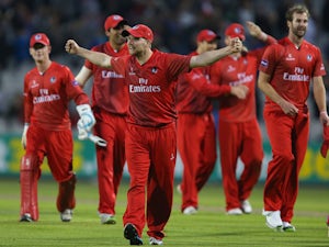 Karl Brown of Lancashire Lightning celebrates victory during The Natwest T20 Blast match between Lancashire Lightning and Birmingham Bears at the Emirates Old Trafford Ground on May 30, 2014 