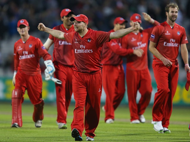 Karl Brown of Lancashire Lightning celebrates victory during The Natwest T20 Blast match between Lancashire Lightning and Birmingham Bears at the Emirates Old Trafford Ground on May 30, 2014 