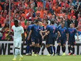 Netherlands' forward Robin van Persie is congratulated by teammates after scoring a goal during the international friendly football match Netherlands against Ghana on May 31, 2014