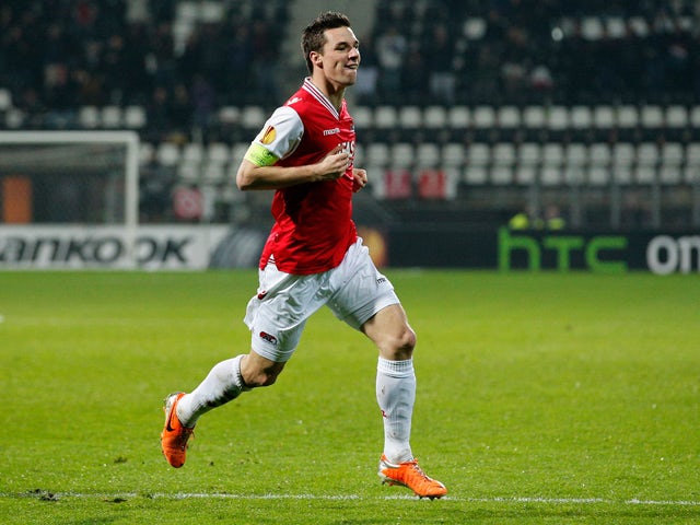 Nick Viergever #4 of AZ is celebrates after he scores his teams first goal of the game during the UEFA Europa League Round of 32 match between AZ Alkmaar and FC Slovan Liberec at the AZ Stadium on February 27, 2014 