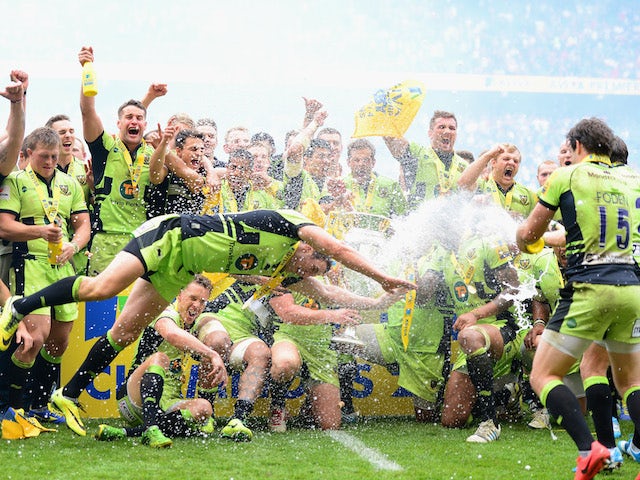 Northampton Saints players celebrate winning the Aviva Premiership Final at Twickenham on May 31, 2014