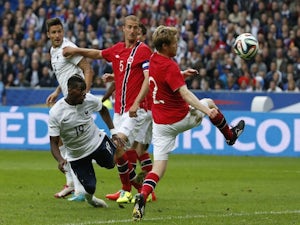 France's midfielder Paul Pogba (L) scores a goal during the friendly football match France vs Norway on May 27, 2014