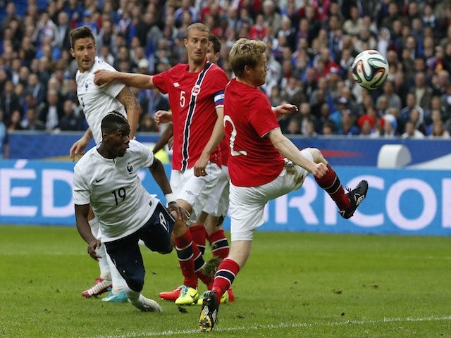 France's midfielder Paul Pogba (L) scores a goal during the friendly football match France vs Norway on May 27, 2014
