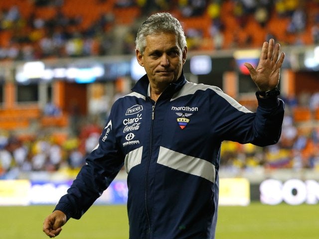 Ecuador coach Reinaldo Rueda waves to supporters before a match against Honduras on November 19, 2013.