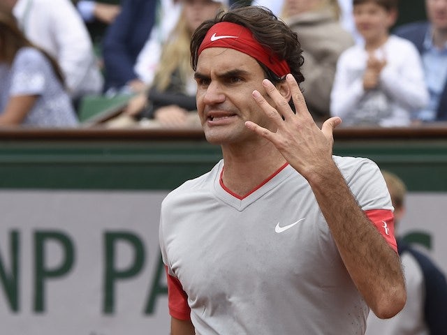 Roger Federer reacts angrily during his French Open fourth round match against Ernests Gulbis on June 1, 2014 