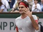 Roger Federer reacts angrily during his French Open fourth round match against Ernests Gulbis on June 1, 2014 