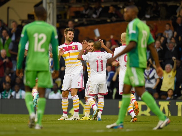 Charlie Mulgrew of Scotland celebrates with teamates after scoring during an International Friendly between Scotland and Nigeria at Craven Cottage on May 28, 2014