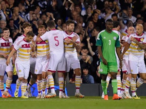  Scotland players celebrate after an own goal by Azubuike Egwuekwe of Nigeria during an International Friendly between Scotland and Nigeria at Craven Cottage on May 28, 2014