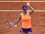Romania's Simona Halep celebrates after winning her French tennis Open second round match against Great Britain's Heather Watson at the Roland Garros stadium in Paris on May 29, 2014