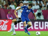 Greece defender Sokratis Papastathopoulos holds off a challenge from German striker Mario Gomez on June 22, 2012.