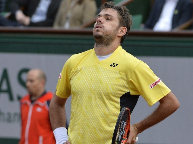 Stanislas Wawrinka reacts after losing a point to Spain's Guillermo Garcia-Lopez during their French tennis Open first round match at the Roland Garros stadium in Paris on May 26, 2014