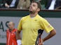 Stanislas Wawrinka reacts after losing a point to Spain's Guillermo Garcia-Lopez during their French tennis Open first round match at the Roland Garros stadium in Paris on May 26, 2014