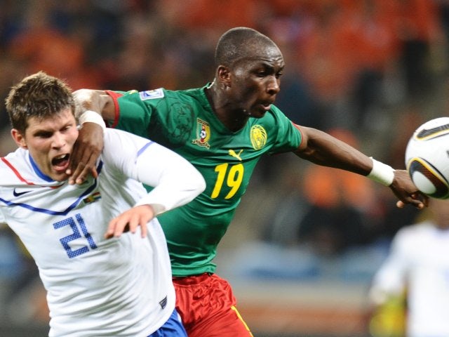 Cameroon midfielder Stephane Mbia battles for possession against Holland on June 24, 2010.