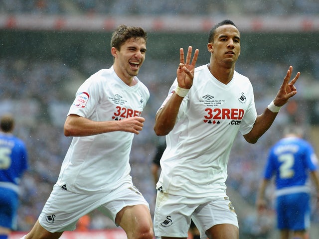 Scott Sinclair of Swansea celebrates his third goal with Fabio Borini during the npower Championship Playoff Final between Reading and Swansea City at Wembley Stadium on May 30, 2011
