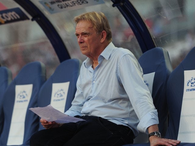 Volker Finke sits in the dugout ahead of Cameroon's match against Tunisia on October 13, 2013.