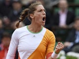 Germany's Andrea Petkovic celebrates after winning a point during her French Open quarter-final against Italy's Sara Errani at the Roland Garros in Paris on June 4, 2014