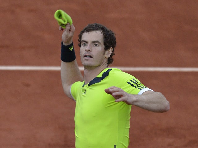 Great Britain's Andy Murray celebrates his victory over France's Gael Monfils at the end of their French tennis Open quarter final match at the Roland Garros stadium in Paris on June 4, 2014