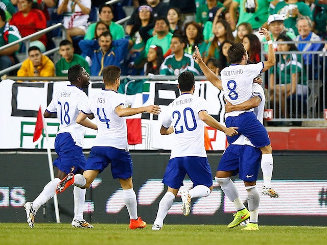 Bruno Alves #2 of Portugal celebrates his goal with teammates in the final seconds of extra time in the second half against Mexico on June 7, 2014