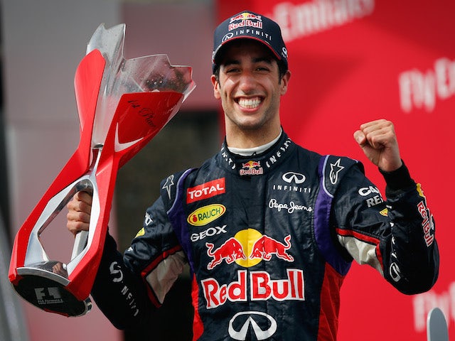 Racewinner Daniel Ricciardo of Australia and Infiniti Red Bull Racing lifts the trophy following his victory during the Canadian Formula One Grand Prix on June 8, 2014