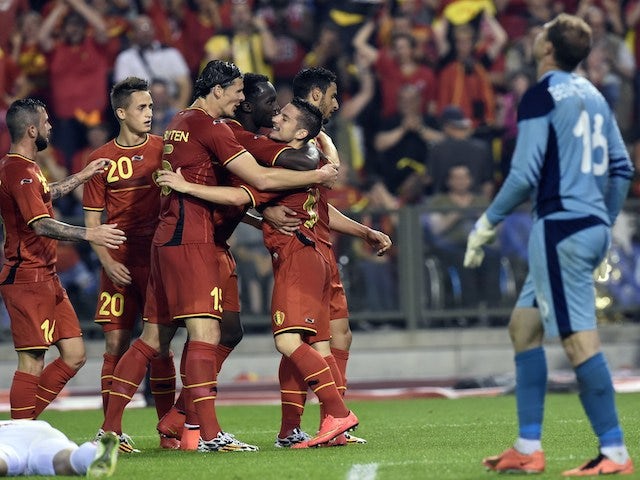 Belgium's forward Dries Mertens (R) celebrates after scoring during during the FIFA 2014 World Cup friendly football match Belgium vs Tunisia at the King Baudouin Stadium, on June 7, 2014