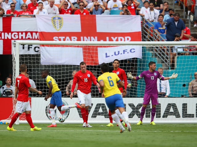 Enner Valencia of Ecuador turns to celebrate after scoring the first goal as Ben Foster of England reacts during the International friendly match between England and Ecuador at Sun Life Stadium on June 4, 2014