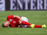 Jack Wilshere of England lies injured during the International friendly match between England and Ecuador at Sun Life Stadium on June 4, 2014