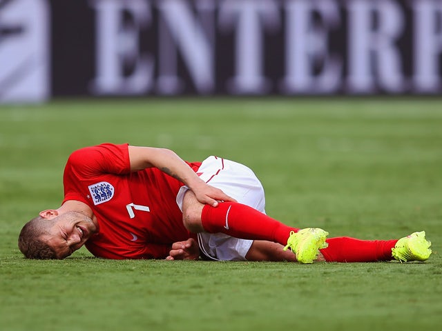 Jack Wilshere of England lies injured during the International friendly match between England and Ecuador at Sun Life Stadium on June 4, 2014