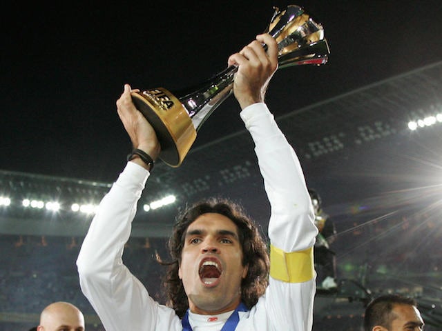 Internacional captain Fernandao (C) holds the champion trophy after their final match against FC Barcelona for the FIFA Club World Cup on December 16, 2006
