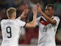 Germany's midfielder Andre Schurrle celebrates scoring with teammate Germany's defender Jerome Boateng during the friendly football match Germany vs Armenia in preparation for the FIFA World Cup 2014 on June 6, 2014