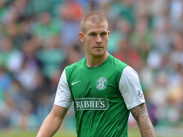 James Collins of Hibernian in action during the Scottish Premiership League match between Hibernian and Motherwell at Easter Road on August 04, 2013
