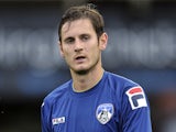 Jonathan Grounds of Oldham Athletic in action during the pre season friendly match between Oldham Athletic and Manchester City at Boundry Park on July 31, 2012