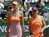Russia's Maria Sharapova (L) and Romania's Simona Halep pose before the start of their French tennis Open final match at the Roland Garros stadium in Paris on June 7, 2014