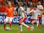  Arjen Robben of Netherlands runs on goal followed by Daniel Gabbidon and Joe Allen of Wales during the International Friendly match between The Netherlands and Wales at Amsterdam Arena on June 4, 2014