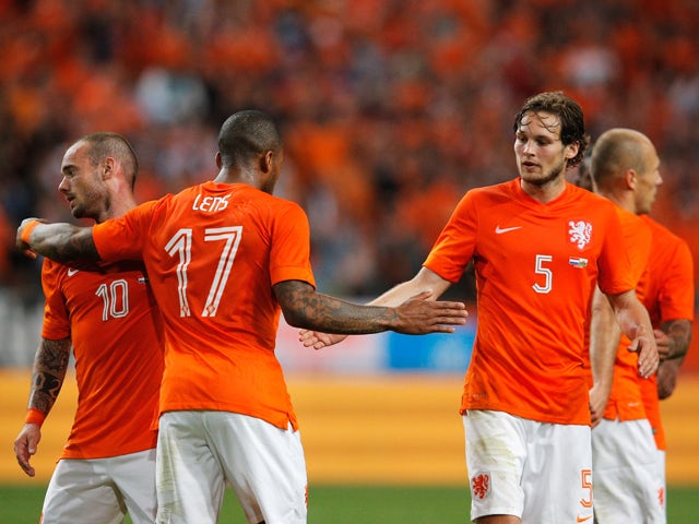 Jeremain Lens of Netherlands celebrates scoring the second goal of the game with Daley Blind and Wesley Sneijder during the International Friendly match between The Netherlands and Wales at Amsterdam Arena on June 4, 201