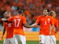 Jeremain Lens of Netherlands celebrates scoring the second goal of the game with Daley Blind and Wesley Sneijder during the International Friendly match between The Netherlands and Wales at Amsterdam Arena on June 4, 201