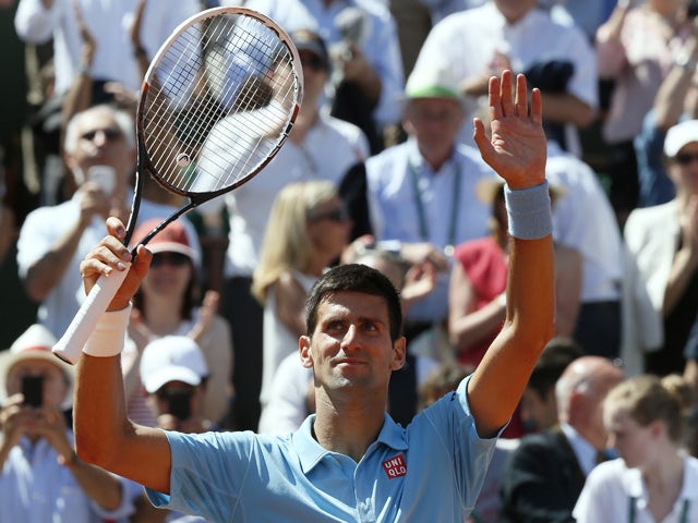 Serbia's Novak Djokovic celebrates his victory over Latvia's Ernests Gulbis at the end of their French tennis Open semi-final match at the Roland Garros stadium in Paris on June 6, 2014
