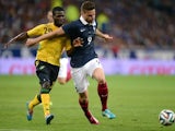 France's forward Olivier Giroud (R) vies with Jamaican's defender Kemar Lawrence during the friendly football match between France and Jamaica at the Pierre Mauroy stadium, on June 08, 2014
