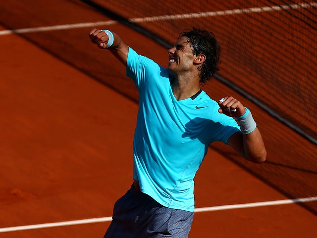 Rafael Nadal of Spain celebrates victory in his men's singles match against Andy Murray of Great Britain on day thirteen of the French Open at Roland Garros on June 6, 2014