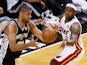Tim Duncan #21 of the San Antonio Spurs with the ball against LeBron James #6 of the Miami Heat during the NBA Finals on June 20, 2013