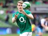 Ireland wing Andrew Trimble warms up ahead of the Six Nations International rugby union match between Ireland and Italy at Aviva stadium in Dublin on March 8, 2014