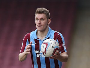 Andy Dawson of Scunthorpe United in action during the Sky Bet League Two match between Scunthorpe United and Northampton Town at Glanford Park on March 8, 2014
