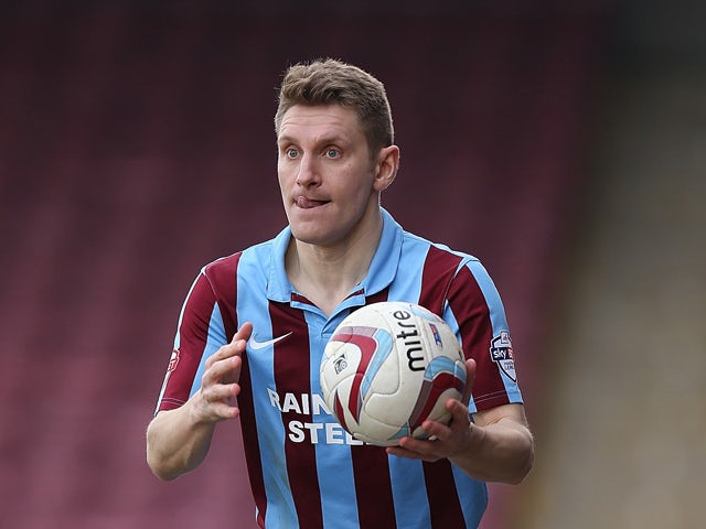 Andy Dawson of Scunthorpe United in action during the Sky Bet League Two match between Scunthorpe United and Northampton Town at Glanford Park on March 8, 2014